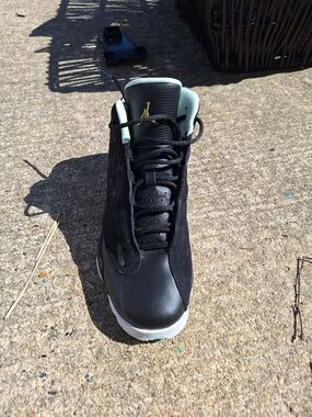 Jordan High-Top Sneaker in Black with Mint and Gold Accents